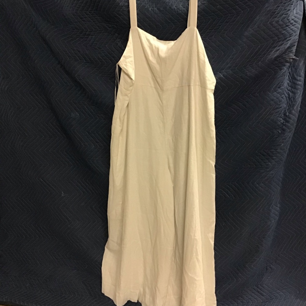 Express white jumpsuit with pockets. Brand new with retail tags and price.